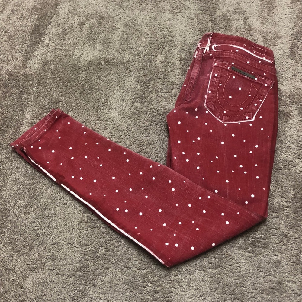 Red paint on white true religion jeans.